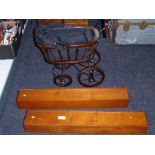 A vintage style doll's pram and two wooden storage cases