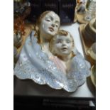 An Italian china relief wall hanging - mother with child,