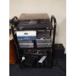 A contemporary trolley containing trio turn table, Denon four piece separate system,