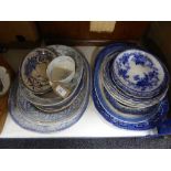 Twenty assorted blue and white meat and dinner plates in an oriental style and a similar teacup