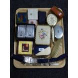 A tray of assorted hand brushes, letter opener, silver plated belt,