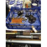 A basket of fishing equipment : reels, lead weights,