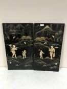 A pair of Japanese Meiji period lacquered and inlaid panels depicting figures in a mountainous