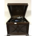 An early 20th century oak table top HMV gramophone,