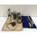 A tray containing plated ware including a three-piece carving set in case with silver collars,