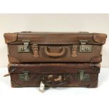 Two vintage leather luggage cases