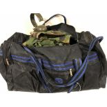 A large holdall containing army DP clothing