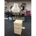 A contemporary beech three drawer bedside chest,