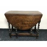 An oak barley twist gate leg table