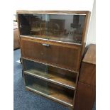 A mahogany four tier stacking bookcase