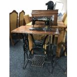 A Singer treadle sewing machine in mahogany table