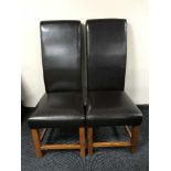 A set of six contemporary leather high backed dining chairs