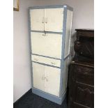 A painted mid 20th century kitchen cabinet