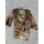 A lady's three quarter length squirrel fur jacket