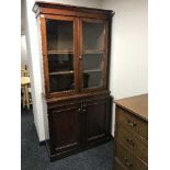 A late 19th century mahogany glazed door bookcase