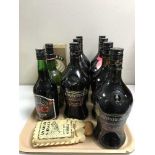 A tray of twelve bottles of alcohol including sherry, Baileys,