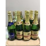 A tray containing twelve bottles of wine and demi-sec including seven bottles of Charmaine,