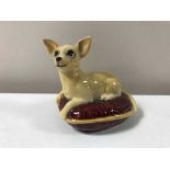 A Beswick Chihuahua on red cushion