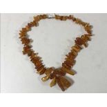 An amber necklace with 9ct gold clasp