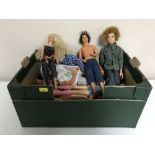 A boxed Barbie play set and a box of Barbie and Ken dolls