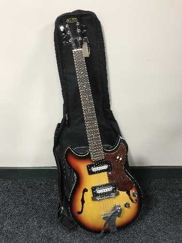 A 1960's Audition electric semi acoustic guitar in soft carry bag