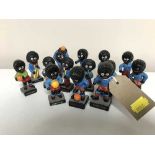 A tray of fourteen Robertson golly figures - footballers and band players