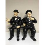 Two figures on a bench - Laurel and Hardy