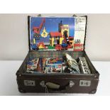 A leather case of boxed vintage Lego