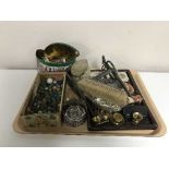 A tray of interesting collectables, three silver backed brushes, marbles, pistol lighter,