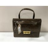 A vintage snakeskin hand bag and purse