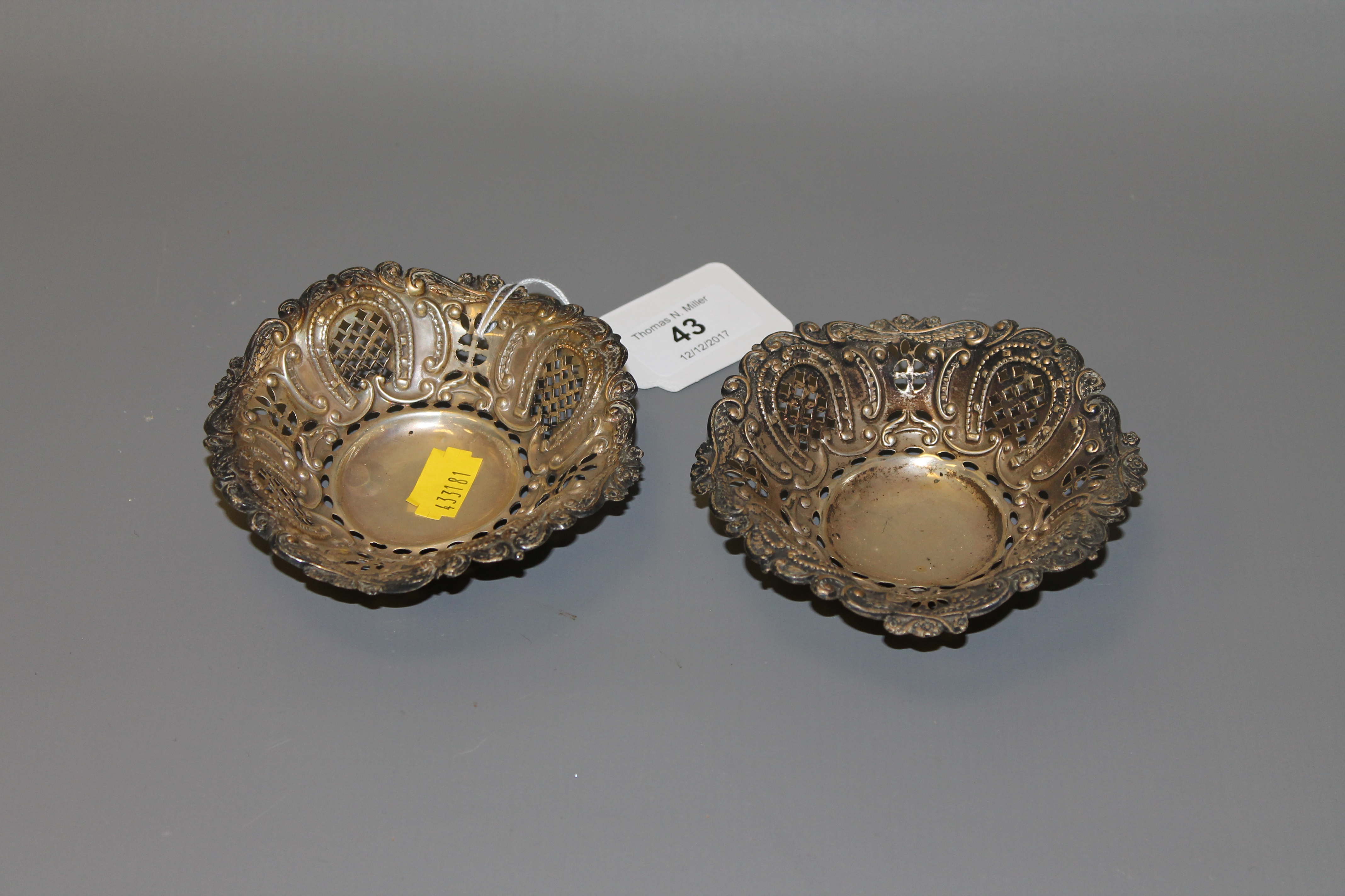 A pair of pierced silver bonbon dishes,