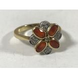 An 18ct gold fire opal and diamond cluster ring, size N.