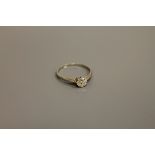 An 18ct white gold diamond solitaire ring, approximately .5ct, size N/O.