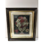 A nineteenth century crewel work panel depicting flowers in a vase, 39 cm x 50 cm, framed.