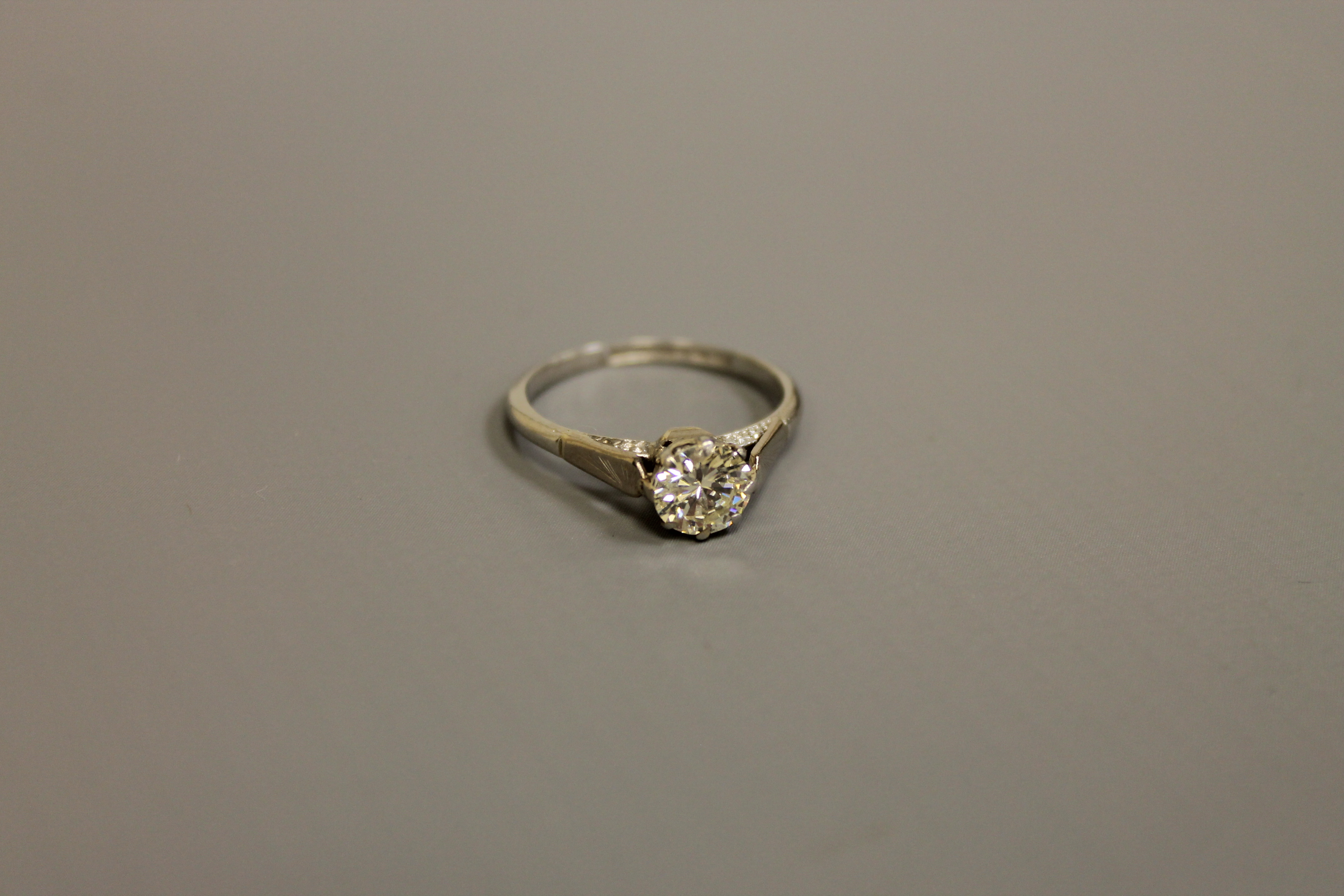 A platinum diamond solitaire ring, approximately 1ct, size K/L.