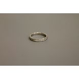 A platinum princess cut diamond half eternity ring, approximately 0.7ct, size M.