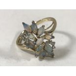 A 9ct gold opal and diamond cluster ring,