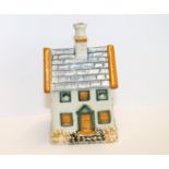 Prattware pottery money box, probably Yorkshire, in the form of a house,