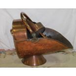 19th century copper helmet shape coal bucket with scoop.