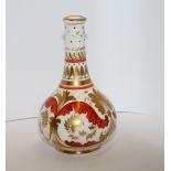 Derby scent bottle of baluster form with tall neck decorated in gilt & iron red with foliate