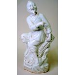 Chinese Republic blanc de chine figure of a fisherman seated on a rock,