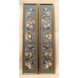 Pair of Chinese silk embroidered sleeve panels, blue ground, 61cm x 11.5cm.