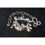 Silver charm bracelet and a similar cloak chain (2).