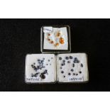 Approx sixty blue sapphires and seven garnets (unmounted)