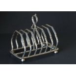 Edwardian silver toast rack on faceted supports by Martin & Hall, Sheffield 1903,