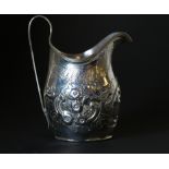 George III silver cream jug of ovoid form, later embossed, 1802,