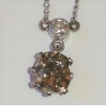 Diamond solitaire pendant with brilliant of cinnamon hue, approximately 1ct.