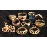 Seven gold rings, a similar necklet, and two pairs of earrings, all 9ct.