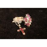 Pink sapphire and diamond cocktail ring in white gold, probably '750', and a similar cross, 9ct,