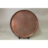 19th century Indian circular copper tray profusely decorated with figures, animals,